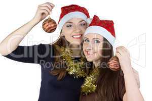 Portrait of two young women with christmas balls