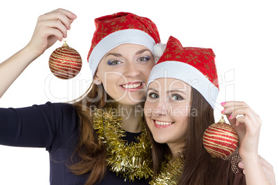 Photo of two young women in christmas hats