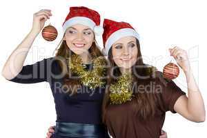 Image of two young women in christmas hats