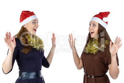Photo of two fun young woman in christmas hats