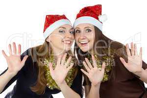 Photo of two happy young woman in christmas hats