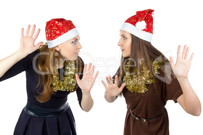 Photo of two eavesdropper young women