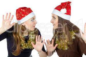 Image of two eavesdropper young women