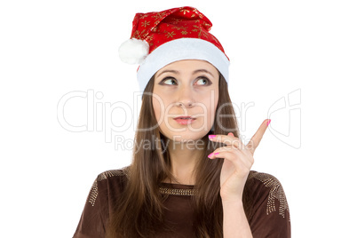 Photo of thinking young woman in xmas hat