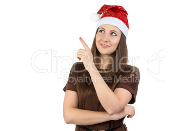 Photo of young woman showing something in xmas hat