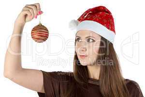Portrait of young woman holding christmas ball