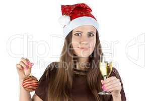 Portrait of woman with christmas ball and glass
