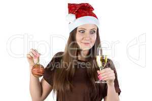 Portrait of woman with christmas ball and glass