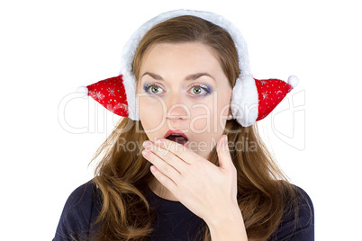 Photo of surprised woman in winter headphones