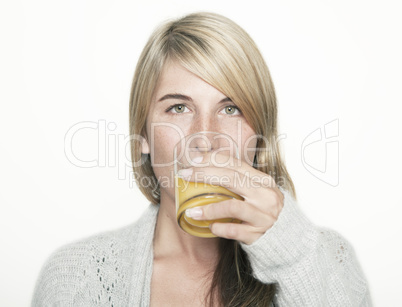 woman drinking orange juice