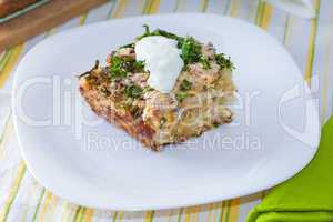 Cauliflower baked with eggs, cheese and dill on top