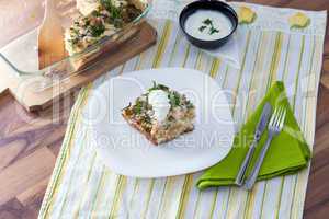 Cauliflower baked with eggs, cheese and dill on top