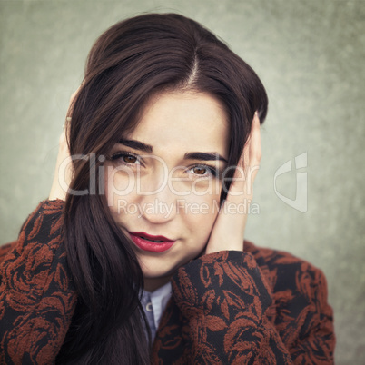 Portrait of young sensual brunette girl outdoors