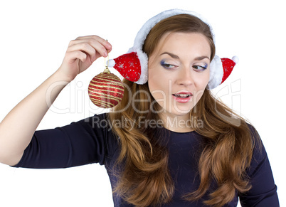 Portrait of woman in winter headphones with ball