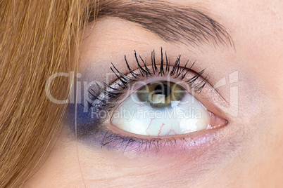 Photo of green woman's eye looking up