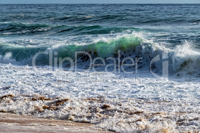 Wave of the Sea on the Sand Beach