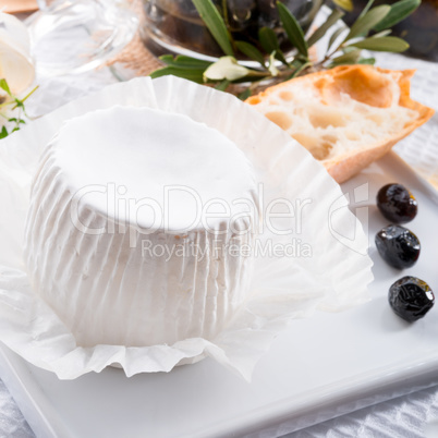 soft cheese with spicy olives