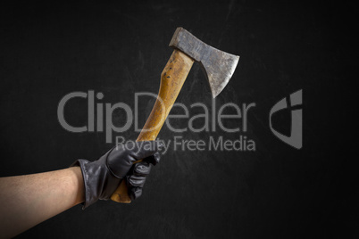 Hand in Leather Gloves with ax
