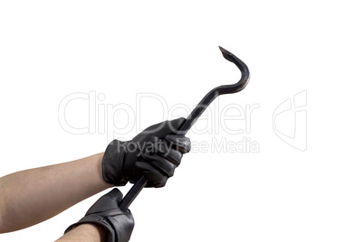 Hand in leather gloves holding jemmy