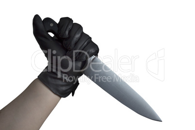 Hand in leather gloves holding knife