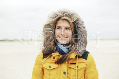 Woman in winter on the beach