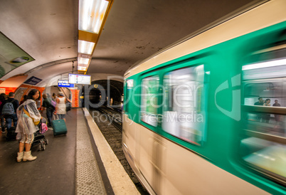 Pairs. Metro train speeding up in the subway