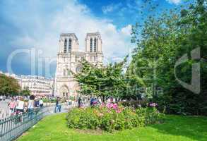 PARIS - JUNE 14, 2014: Tourists visit Notre Dame. More than 30 m