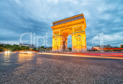 Triumph Arc with city traffic at night, Paris