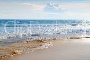 seascape, sand beach and blue sky