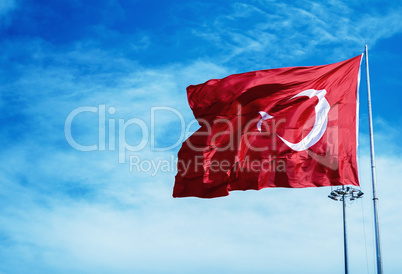 Turkey flag waving against the blue sky