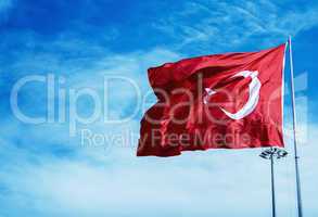 Turkey flag waving against the blue sky