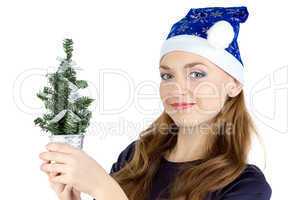 Portrait of woman with small christmas tree