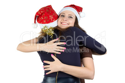 Image of two happy hugging young women