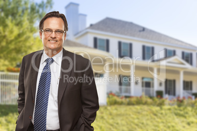 Attractive Businessman In Front of Nice Residential Home