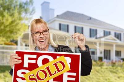 Excited Woman Holding House Keys and Sold Real Estate Sign