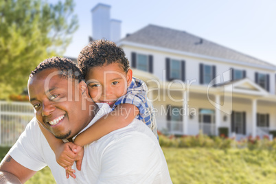 African American Father and Mixed Race Son, House Behind