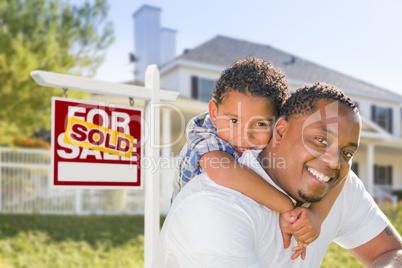 African American Father and Mixed Race Son, Sold Sign, House