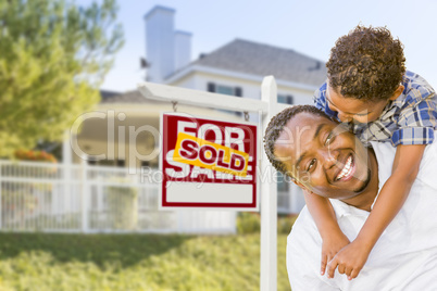 African American Father and Mixed Race Son, Sold Sign, House