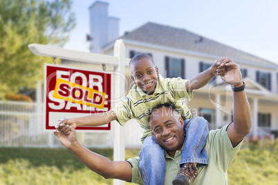 African American Father and Son, Sold Sign and Home