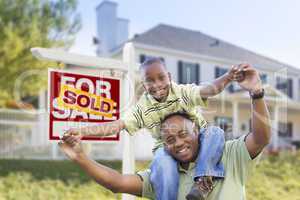 African American Father and Son, Sold Sign and Home