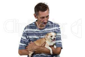 Image of the old man looking at dog