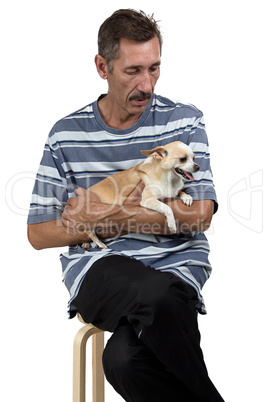 Portrait of the old man looking at dog
