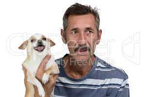 Photo of the old man holding dog