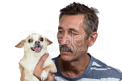 Image of the old man holding dog