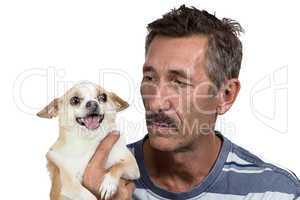 Image of the old man holding dog