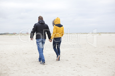 couple at the beach in winter