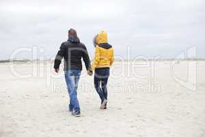 couple at the beach in winter