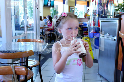 beautiful girl having dinner in cafe