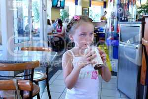 beautiful girl having dinner in cafe