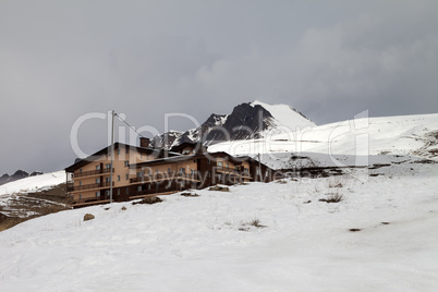 Hotel and ski slope in gray day